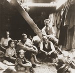 Jewish refugees from the Kladovo transport sit below deck during their journey from Kladovo to Sabac.