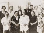 Group portrait of the staff and administrators of the OSE children's clinic in Cernauti, Romania.