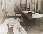 Sheets cover the bodies of slave laborers found in a room in the Dortmund POW camp.