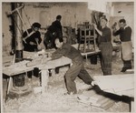 Jewish DPs build chairs in a carpentry shop in the Bindermichl displaced persons camp.