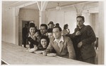 A group of Jewish DPs eat in the mess hall at the Schlachtensee displaced persons camp.