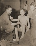 American medics treat an emaciated, twenty-year-old soldier, Pfc.
