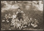 A teacher poses with his students from a Feldafing cheder on a picnic excursion.