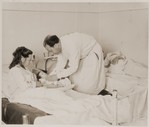 A doctor examines a newborn infant in the maternity ward of a hospital in Sankt Marien, Austria.