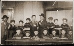 Group portrait of Jewish boys studying traditional Jewish texts at a religious school in the Feldafing displaced persons camp.