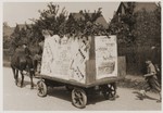 An election campaign wagon at Neu Freimann displaced persons camp covered with posters urging voters to support List #4.
