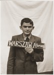 Abram Warszaw with a name card intended to help any of his surviving family members locate him at the Kloster Indersdorf DP camp.