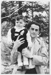 Josef Baldo, formerly a Bielski partisan, poses with his young son.