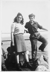 Two teenagers pose on the deck of the Champollion.
