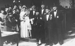 The newly married couple, Herman de Leeuw and Annie Pais, pose with members of the wedding party shortly after the ceremony.