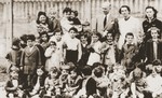 Group portrait of children and staff at the La Pouponniere children's home in Uccle.