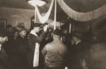 Rabbi Herbert Friedman blesses a bride and groom under a marriage canopy during a wedding at the Berlin chaplain's center.