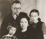 Portrait of Izaak and Malka Fajnsztejn with their daughters, Alicja and Zofja, in the Warsaw ghetto.