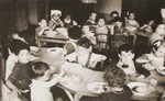 Toddlers at the La Pouponniere children's home in Belgium eat a meal in the dining room.
