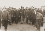 Rabbi Herbert Friedman escorts Zionist leader David Ben-Gurion through a crowd of admirers in the Babenhausen DP camp.