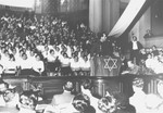 Yitzhak Ben Aharon, a labor leader from Palestine, addresses a meeting of German Jews in a synagogue in Berlin.