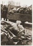 The bodies of Buchenwald victims piled on the back of a truck and on the ground next to it.