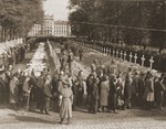 German civilians from Ludwigslust file past the corpses and graves of 200 prisoners from the nearby concentration camp of Woebbelin.