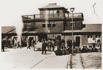 Visitors gather at the entrance to the Buchenwald concentration camp soon after liberation.