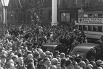 A large crowd of Germans fills the streets of Cologne during a Nazi rally.