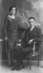 Studio portrait of a Polish Jewish couple, members of the Szczupacki family.