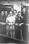 Members of the Petranker and Hut families pose on a balcony.