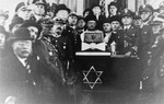 Chief Rabbi of the Polish Army, Boruch Steinberg poses with a group of Polish officers in a Krakow synagogue.