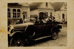 A visitor to Eisiskes takes his friends for a car ride in the early 1930s.