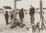 The bodies of Steven Borota and Yossipe Mayer, two Serbian partisans, hang from a gallows in Valjevo, where they were executed by Croatian collaborators under the command of Milan Neditch.