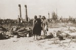 Survivors of the Kovno ghetto view the ruins of the ghetto after liberation.