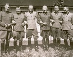Commandant Franz Ziereis poses with members of the SS staff of the Mauthausen concentration camp.