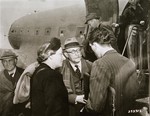 Former French Premier Leon Blum and his wife are greeted by T.S.