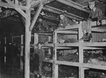Survivors sit in multi-tiered bunks in a barracks in the newly liberated Buchenwald concentration camp.