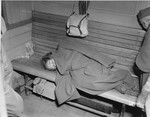 A Jewish girl liberated in Buchenwald sleeps during the train ride from the camp to France.