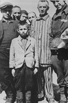 A group of survivors, including a young boy, in Buchenwald after liberation.