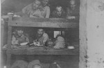 Survivors in Buchenwald who are still too weak to leave lie in their bunks.