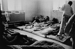 Survivors rest on mattresses in a make-shift infirmary in Buchenwald.