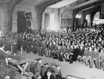 American chaplain Rabbi Hershel Schaecter conducts Shavuot services for Buchenwald survivors shortly after liberation.