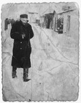 Moshe Lachter wrapped in a winter coat and boots returns home from the synagogue after morning prayers.