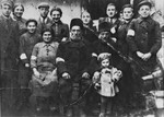 Portrait of the extended Lachter family wearing armbands in the Turobin ghetto.