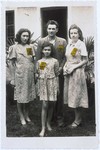 Members of a Jewish family pose outside their home in Zagreb wearing the rectangular, yellow Jewish badges required by the Croatian regime.