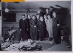 Group portrait of Jewish survivors in a cellar storeroom in Berlin in which a stash of abandoned Torah scrolls was found.