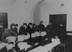 Former SS members are made to sort through captured records that will be presented as evidence before the International Military Tribunal war crimels trial at Nuremberg.