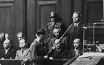 Defendant Mathias Graf pleads "not guilty" during his arraignment at the Einsatzgruppen Trial.