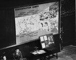 Photographs, artifacts, and a map presented as evidence at the International Military Tribunal trial of war criminals at Nuremberg.