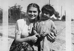 The photographer's sister poses with a Romani child in hiding during the German occupation.