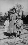Three Romani children in hiding during the German occupation.