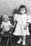 Blanche Karakowski stands next to her doll.
