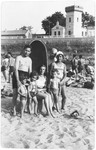 The Eichenholz family poses by a cabana during a vacation to the beach.