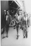 Three young men walk down a street in Rome.

Pictured are Di Tivoli, Giuseppe Di Porto and Isacco Bonnino.